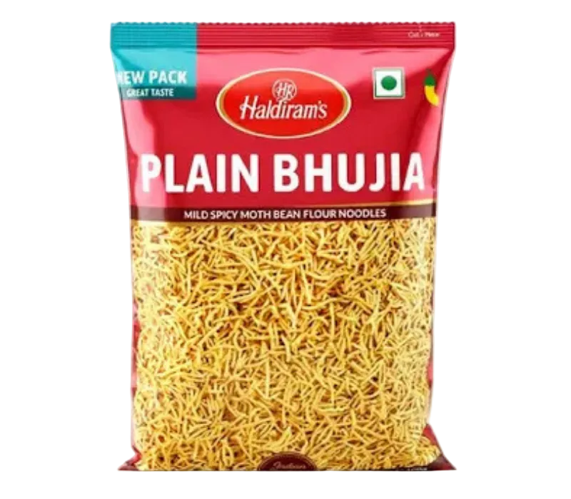 A bag of Haldiram's Plain Bhujia mild spicy moth bean flour noodles, featuring a red and teal packaging design with a clear window showing the yellow-beige noodles inside.